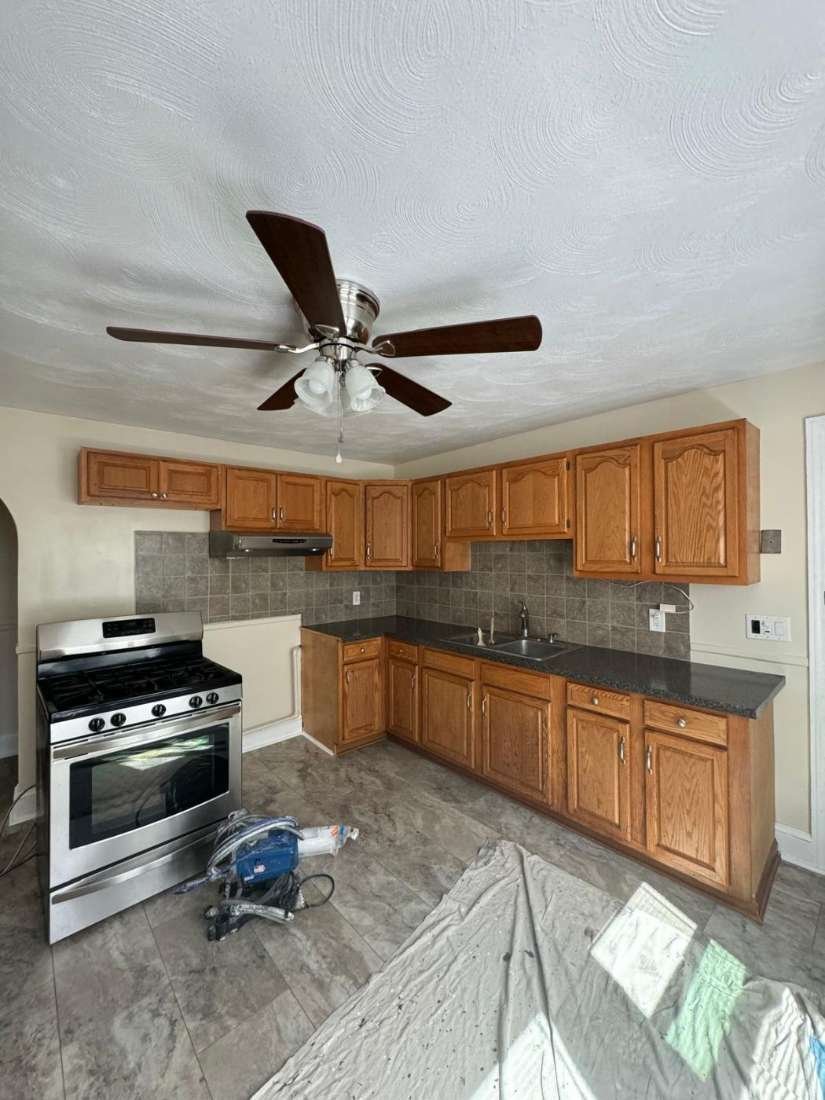 Residential Kitchen · Before – Original cabinets before repainting