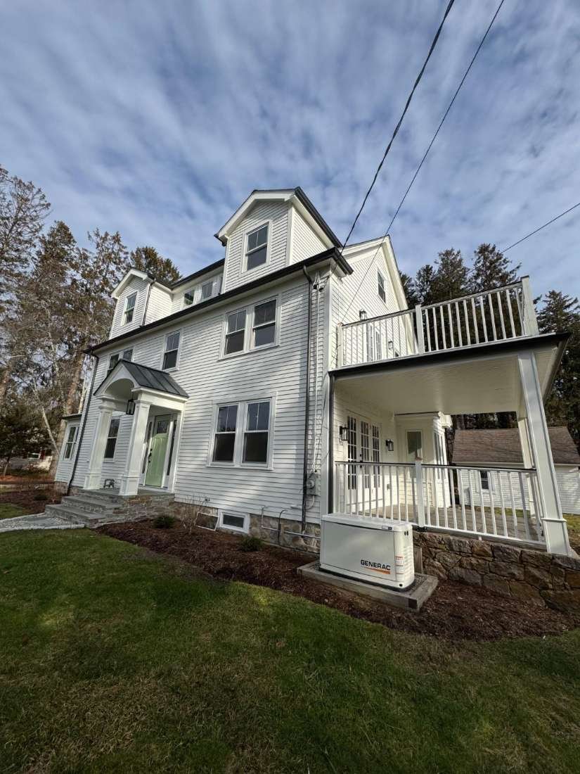 Colonial Renovation · Rhode Island – Full exterior repaint after siding and porch work